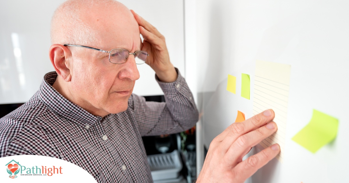 A senior looks at a board confused, representing one of the potential signs of dementia.